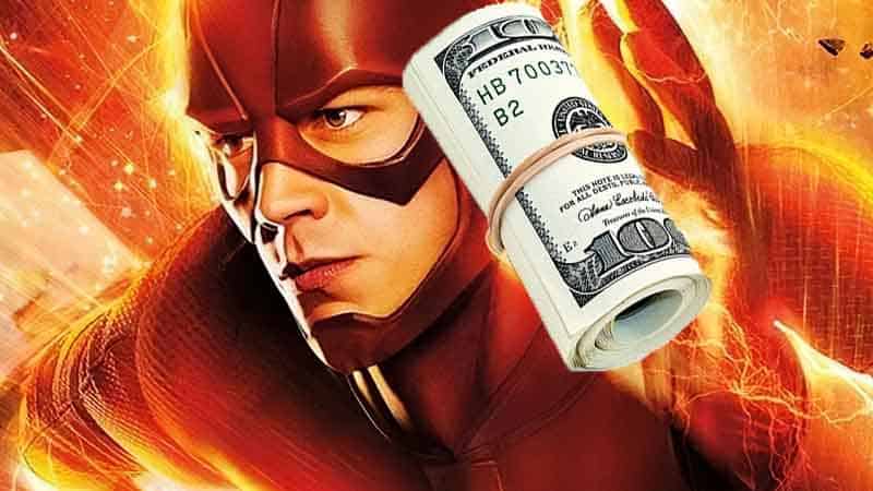 The Flash with a roll of cash in his hand